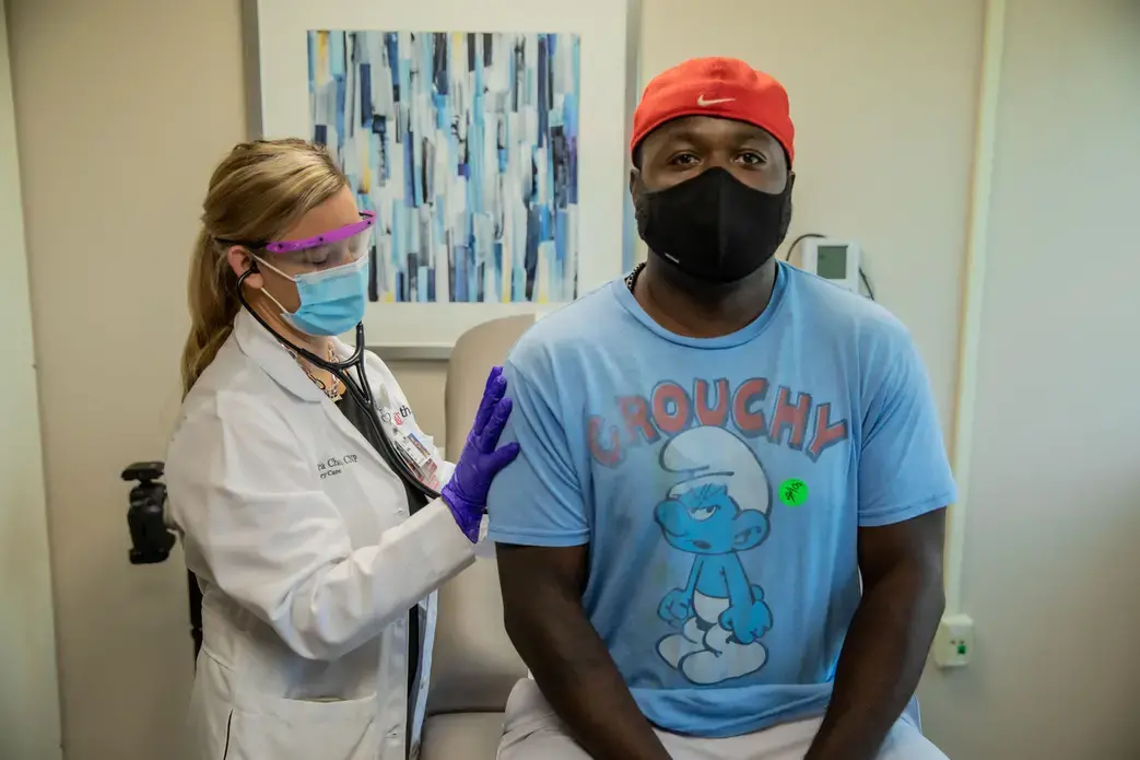 This man in Ohio was among the tens of thousands who received Moderna's experimental COVID-19 vaccine in a recent trial that demonstrated 94.1% efficacy. Image courtesy of University of Cincinnati Health. United States, 2020.