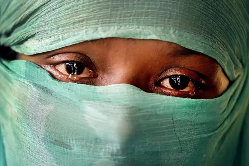 In this Wednesday, Nov. 22, 2017, photo, F, 22, who says she was raped by members of Myanmar’s armed forces in June and again in September, cries as she speaks to The Associated Press in her tent in Kutupalong refugee camp in Bangladesh. The Associated Press has found that the rape of Rohingya women by Myanmar’s security forces has been sweeping and methodical. The AP interviewed 29 women and girls who say they were raped by Myanmar’s armed forces, and found distinct patterns in their accounts, their…