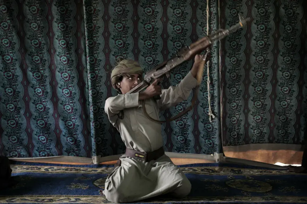 Kahlan, a 12-year-old former child soldier, demonstrates how to use a weapon, at a camp for displaced persons where he took shelter with his family, in Marib, Yemen in this July 27, 2018 photo. Houthi rebels took Kahlan and his classmates, promising to give them new school bags, but instead they were enlisted and trained as fighters tasked with carrying supplies to the front lines. There, he had to elude explosions and airstrikes that left mangled casualties on the battlefield. "The sight of the bodies was…