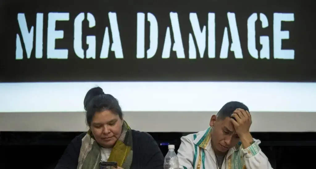 Loretta Miswaggon, left, and Carlton Richards, both of Pimicikamak Territory in Manitoba, Canada, prepare to talk about the impacts of 'mega-dam' hydropower has had on indigenous tribes in Manitoba during a speaking tour at Preble Hall at the University of Maine in Farmington on Nov. 25, 2019. Image by Michael G. Seamans. United States, 2019.