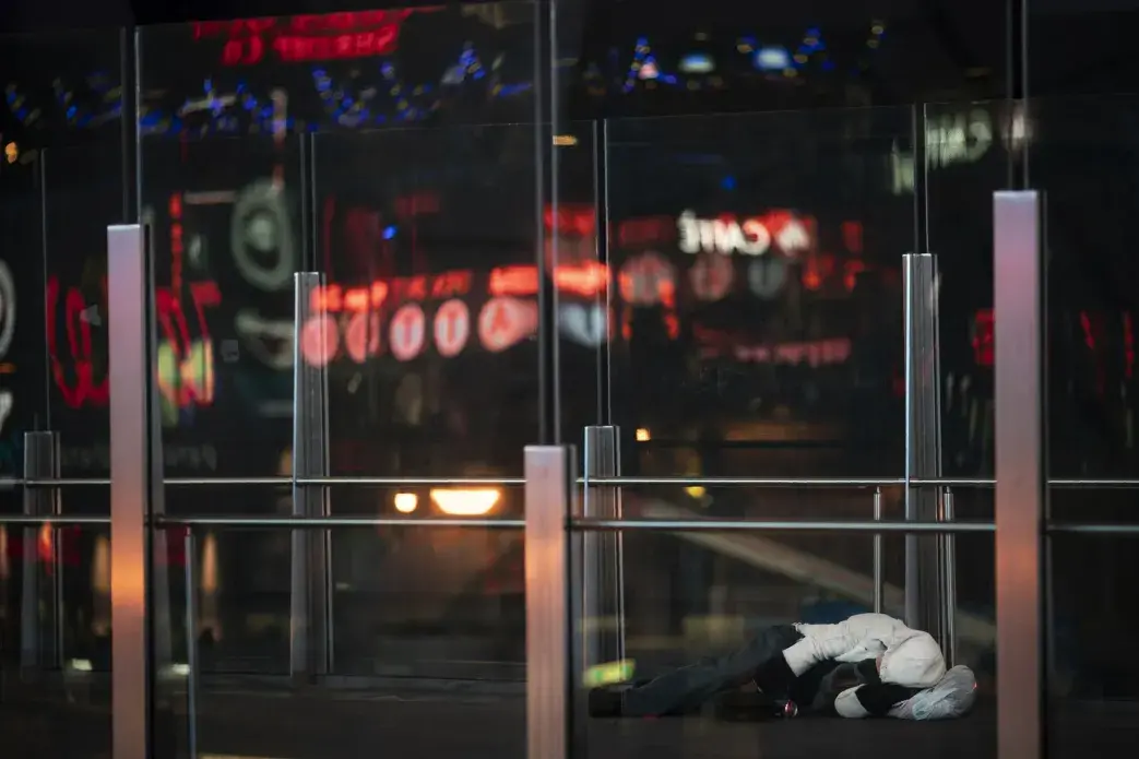 A homeless person sleeps on an overpass along the Las Vegas Strip, Wednesday, Nov. 11, 2020.&nbsp;Image by Wong Maye-E / AP Photo. United States, 2020.
