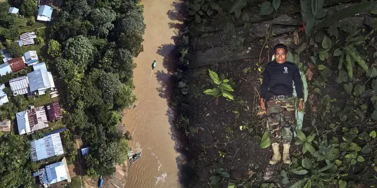 jose gregorio.jpg On the right, José Gregorio poses for an aerial portrait showing the front of his organization's shirt. On the left, an aerial view of the Amazon rainforest that surrounds the Amacuyacu river in Colombia.