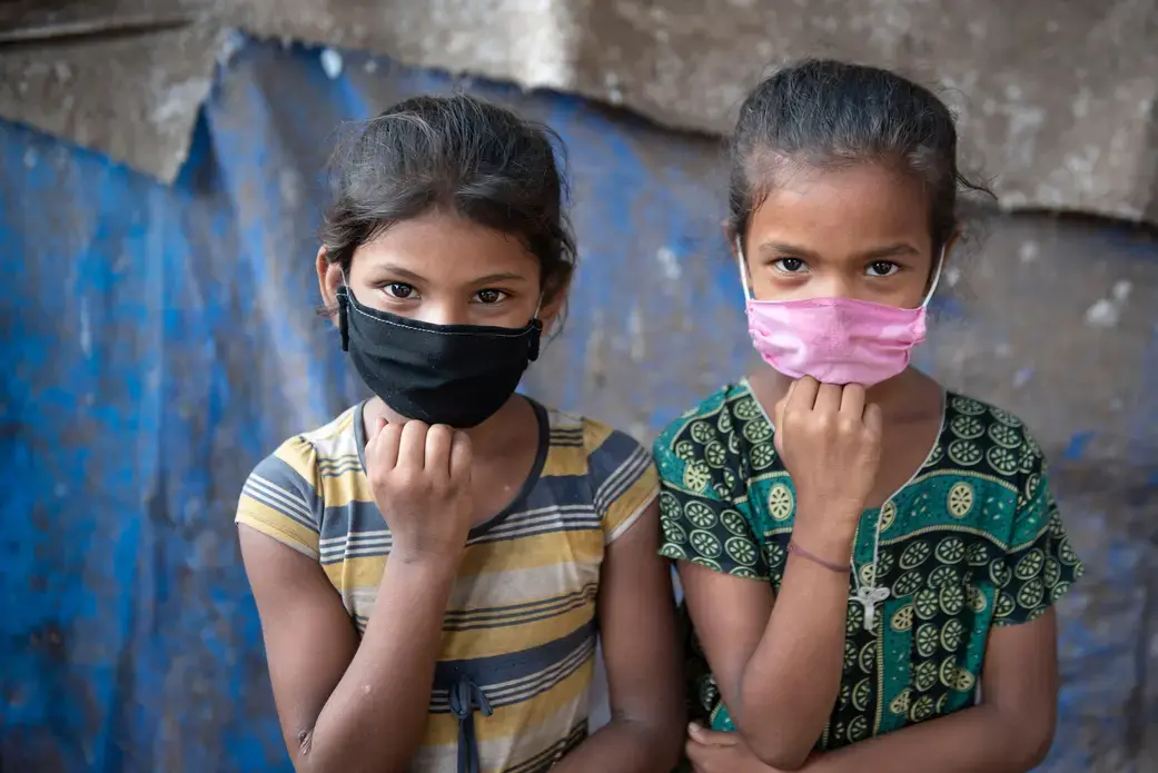 Masked children in Mumbai India.