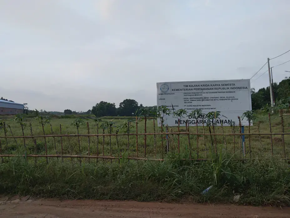 The empty field with a sign post on the site of Agrinas's Research and Development Center, or Agrinas Capability Center, in Kertarahayu village, Bekasi Regency, West Java, September 27, 2021.