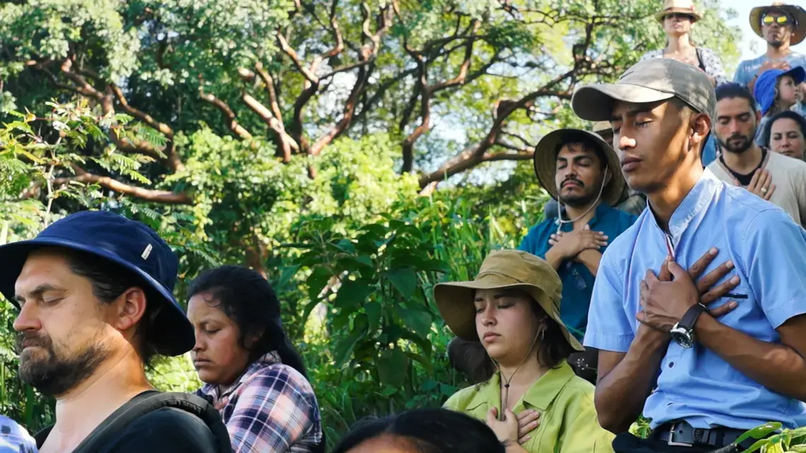 Santos Istazuy Pérez (right) sits in meditation