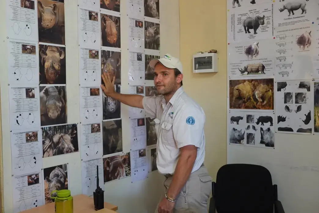 Jes Gruner, the park manager, discusses the black rhinos introduced to the park this year. These rhinos were transported from South Africa. Image by Elham Shabahat. Rwanda, 2017.