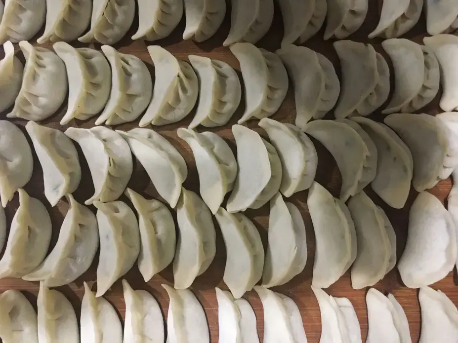 A plate of dumpling ready to be cooked during a dumpling making course at The Orchid hotel on Tuesday, Sept. 19, in Beijing, China. Image by Kelsey Kremer. China, 2017.