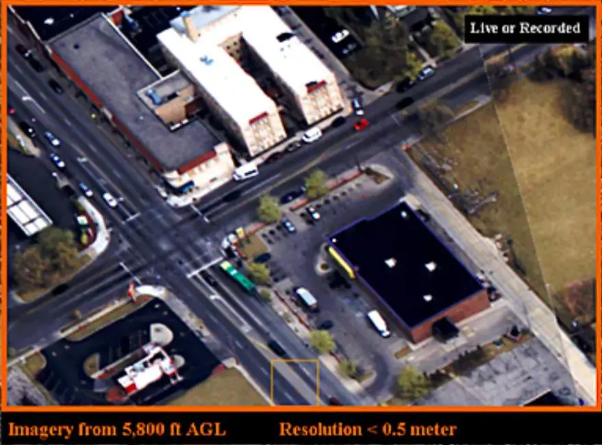 An aerial surveillance image (not captured in Baltimore), and a zoomed in area of that image used for crime analysis and tracking. Image courtesy of the NYU Policing Project. United States, undated.<br />
