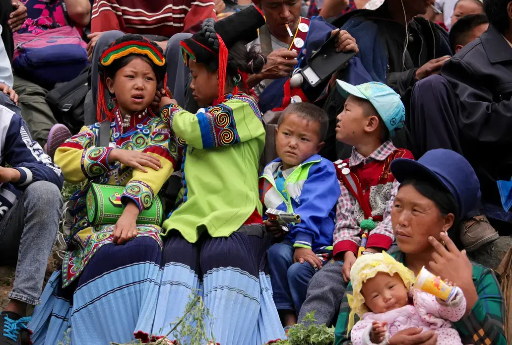 Crowds gather for performances during Torch Festival celebrations in Liangshan prefecture, Sichuan province. Image by Max Duncan. China, 2016.