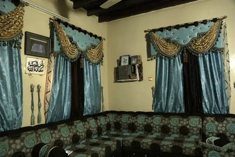 This Feb. 12, 2018, photo shows the interior of a home in Mocha, Yemen. Even with a civil war in full swing, people seek some simple recreations and acts of normal life. Image by Nariman El-Mofty. Yemen, 2018. </p>
<p>