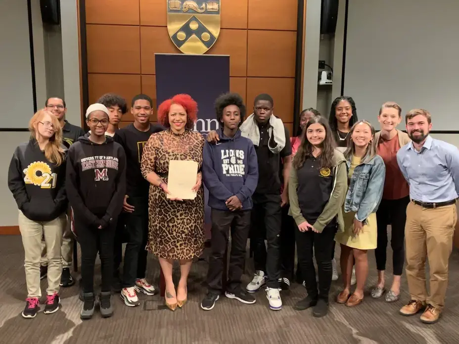 Image of students from George Washington Carver High School in Philadelphia, PA pose with Nikole Hannah-Jones from&nbsp;The New York Times Magazine