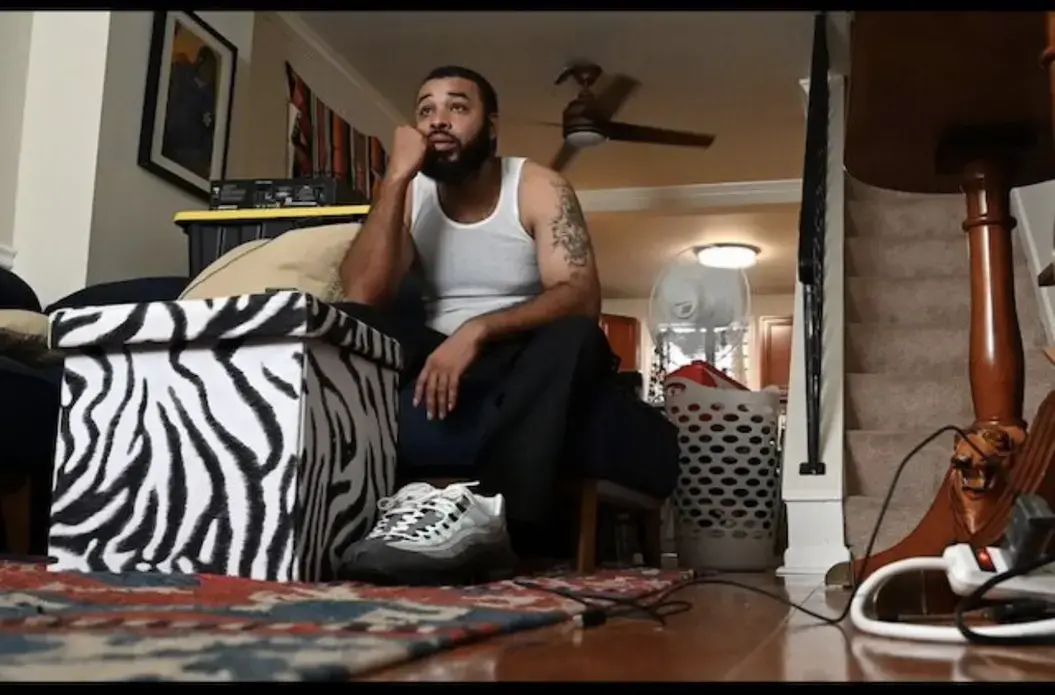 Arthur Gilliam, 37, is renting an East Baltimore rowhouse for $1,000 that's big enough for his five kids to visit. He was working as an electrician's helper for $13 an hour, but quit that job after the state garnished a third of his paycheck for current and back child support, leaving him with $1,500 a month before taxes. Image by Lloyd Fox / Baltimore Sun. United States, undated.