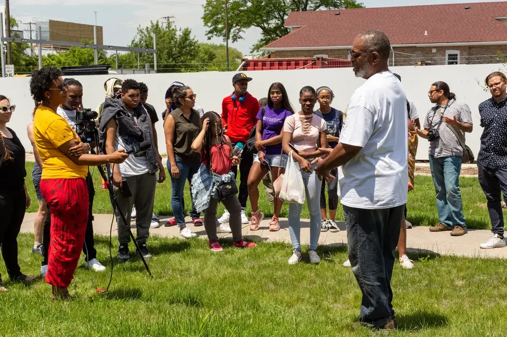 On the community walk in June, the students stopped in Independence Square Park to interview Paul Norrington, a lifelong resident of the North Lawndale. Norrington discussed the history of the neighborhood, including Martin Luther King, Jr.’s time spent there and the Obama Presidential Library.  He told the students about a time machine that would be buried in the park, and hoped they would include the films the students would produce for future residents to watch.  Image by Claire Seaton. United States, 2019.