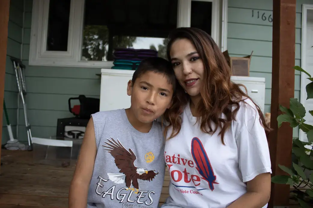 Bernadette Demientieff and her son at their home. Image by Amy Martin. United States, 2019.