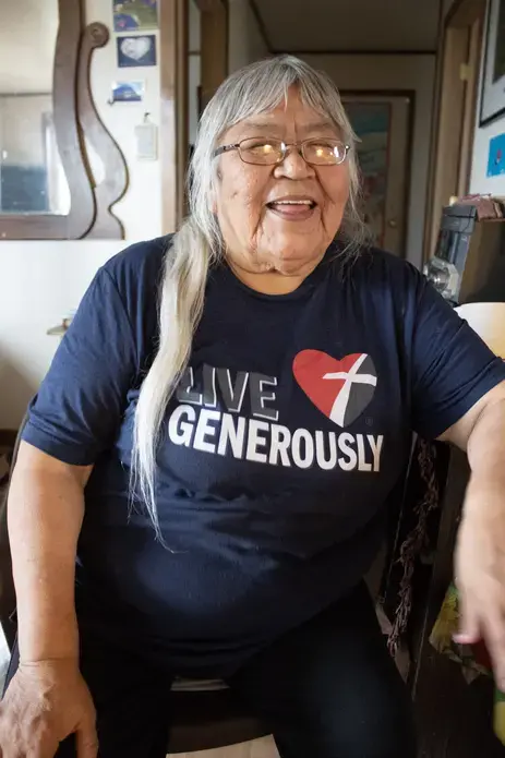 Sarah James in her home. Image by Amy Martin. United States, 2019.