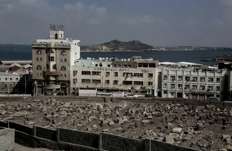 This Feb. 17, 2018, photo shows the Mercedes Benz building damaged in Aden, Yemen. Once a peg in a thriving commercial center that sprang up under colonial rule, the dealership sits empty and pockmarked with bullet holes. Its damaged sign now stands over bay windows boarded up by people sheltering inside. With the war still raging, nothing is being rebuilt. Image by Nariman El-Mofty. Yemen, 2018.</p>
<p>