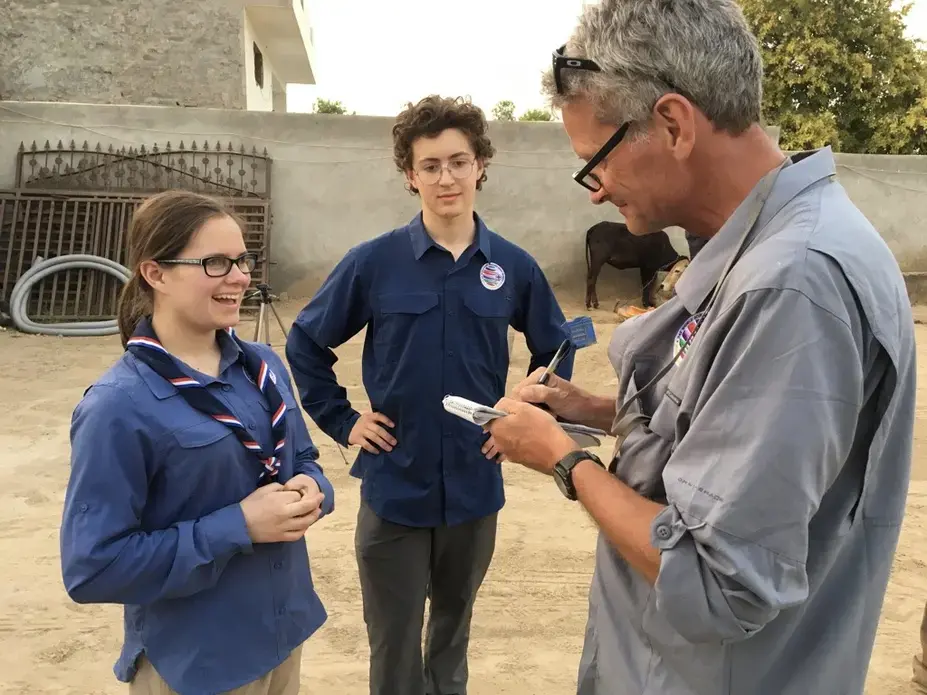 Soaking up the craft: Miciah Thacker, left, and Chris Sherman with Paul Salopek in northern India. Image by Mark Schulte. India, 2018.