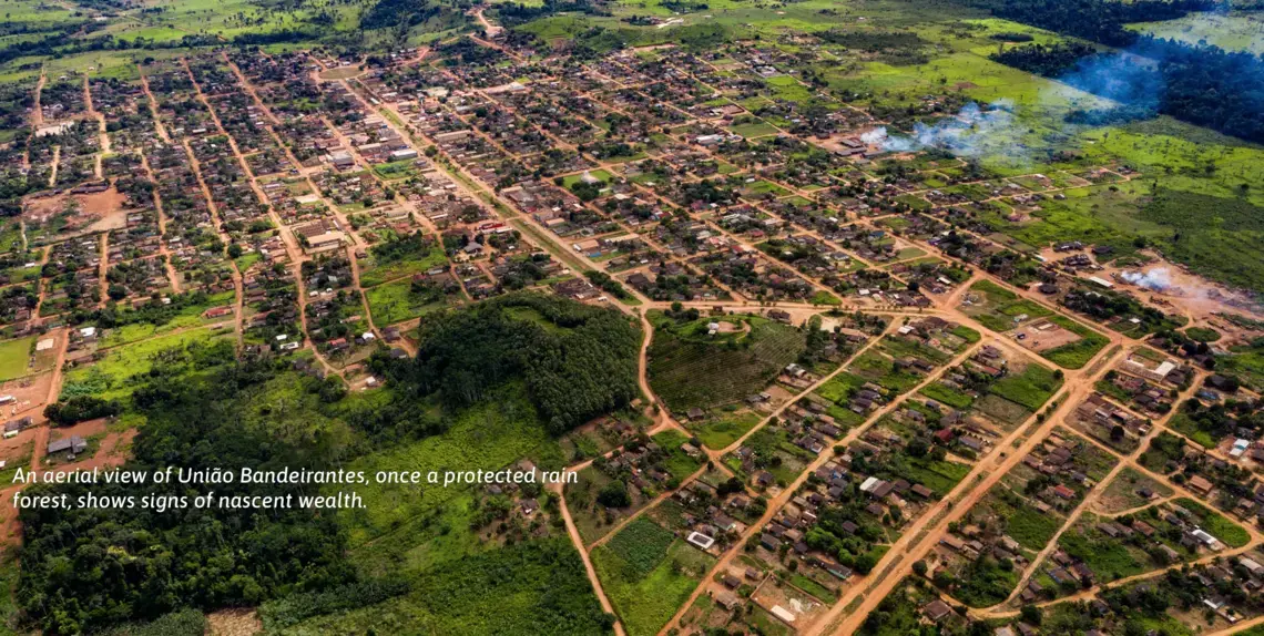 An aerial view of União Bandeirantes, once a protected rain forest, shows signs of nascent wealth. Image by Sebastián Liste. Brazil, 2019.