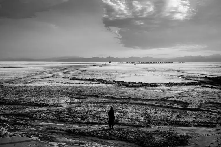 Over the last 20 years, climate change has led to higher temperatures in the region and caused the lake to shrink. Most of the lake's surface area is now a cracked, salty desert. Image by Ako Salemi. Iran, 2016.