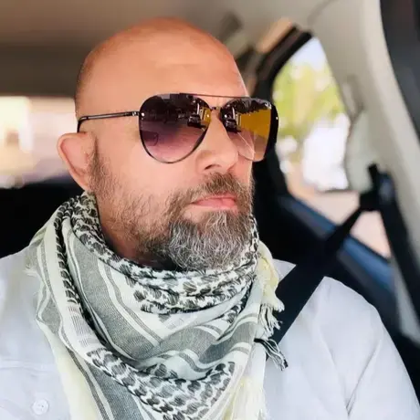 Rogério Florentino Pereira wearing sunglasses