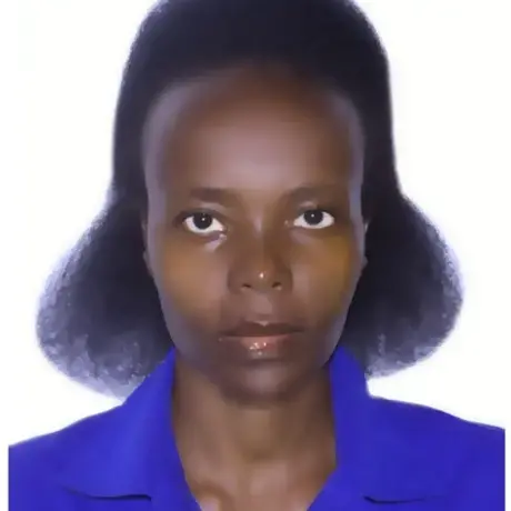 MY-PICTURE.jpeg A woman with brown hair wears a purple shirt.