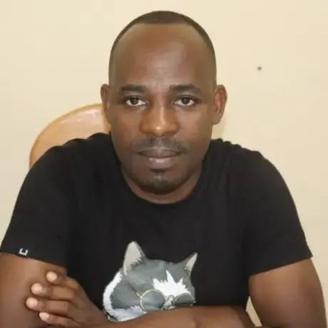 A man wears a black shirt.