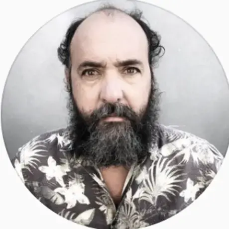 A man stares into the camera