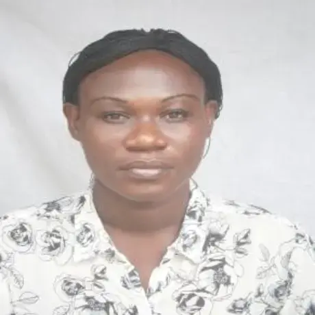 ss.jpg A woman wears a white floral-patterned shirt.