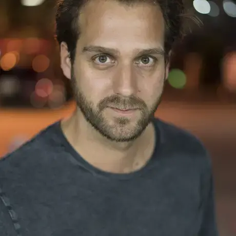 A man wearing a grey shirt