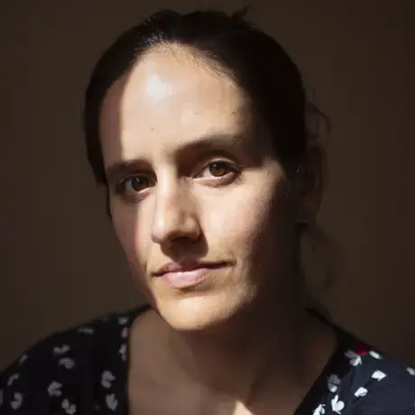 Headshot of Danielle wearing a navy pattered shirt