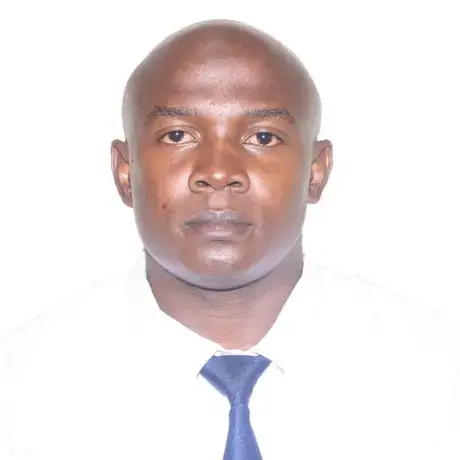 Headshot of Dennis against a white background