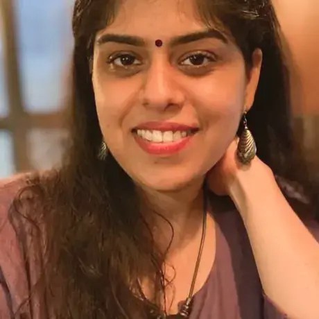 Headshot of Shagun wearing a purple shirt