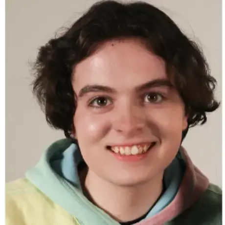Headshot of Declan wearing a colorful hoodie