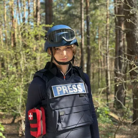 Theia Chatelle in a helmet and press vest
