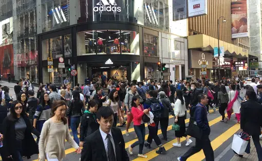 A workday street scene from the "Central" neighborhood, in Hong Kong, which was the scene of unprecedented anti-government protests in 2014. Image by Howard W. French. China, 2017.