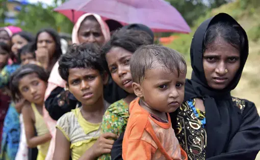 Rohingya wait in a queue in Cox's Bazar. Image by Sk Hasan Ali / Shutterstock.com. Bangladesh, 2017.