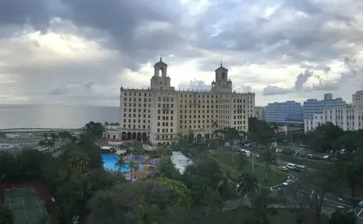 Three aspects of Havana's skyline meet on a cloudy day: the Malecón, Vedado, and Havana Vieja. Image by Esohe Osabuohien. Cuba, 2018.
