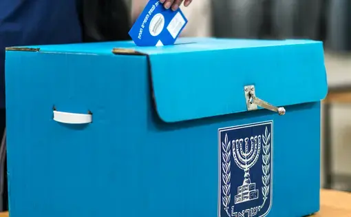 A vote is cast in an Israeli national election. Image by John Theodor / Shutterstock. Israel, 2019.
