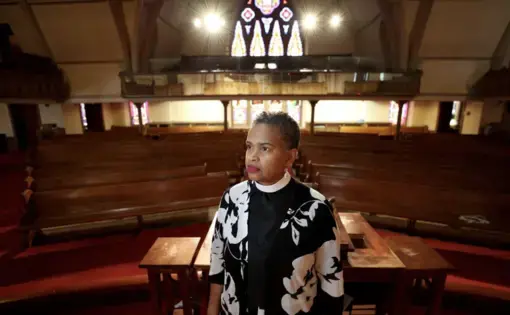 Leslie D. Callahan, pastor of St. Paul's Baptist Church, poses for a portrait, at her church in North Philadelphia on April 8. Image by David Maialetti / The Philadelphia Inquirer. United States, 2020.