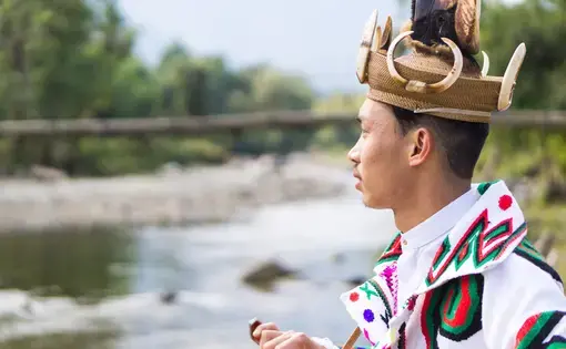 Kachin Boy at Jade Stream, Ziadam Village, Kachin State. Image via Shutterstock. Myanmar, 2020.
