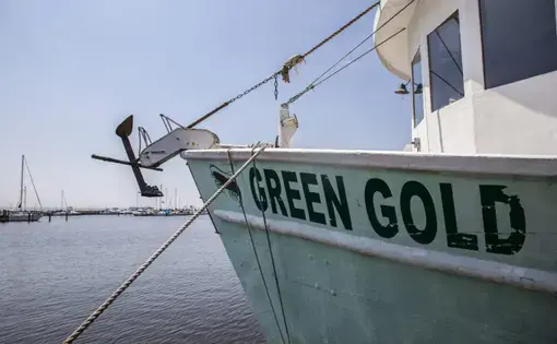 A boat at Pass Christian Harbor. Image by Eric J. Shelton for Mississippi Today. United States, 2019.