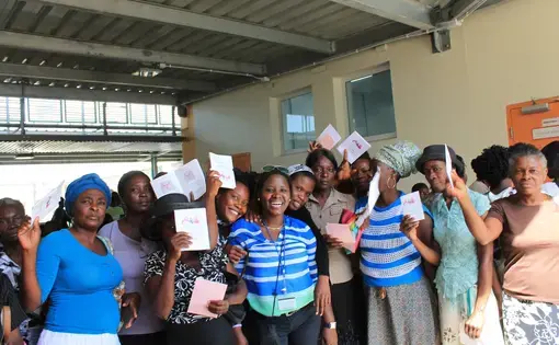 At the end of the education session, the group gathers for a picture. Most of these women will stay to get cervical cancer screenings and, if needed, cryotherapy. The other women will come back the next day to get screened. An individual screening takes about five minutes and women are moved through quickly. Both the nurses and Holdie perform the screenings on the women. Women who test positive line up against one wall and wait for the cryotherapy treatment. Cryotherapy is a painful, 11-minute long…