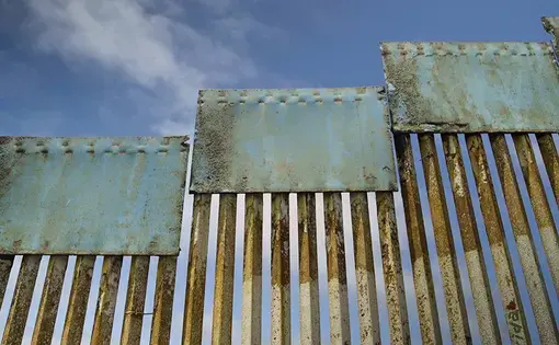The U.S.-Mexico border. Image by Tu Olles / Shutterstock. Mexico, undated.