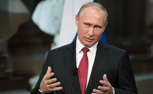 Russian President Vladimir Putin speaking at a press conference at the Palace of Versailles. Image by Frederic Legrand - COMEO / Shutterstock.com. France, 2017.