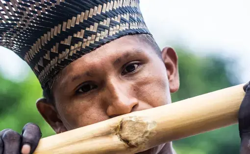 The sound of the bamboo flute signals a ritual. Image by Matheus Manfredini. Brazil, 2019.