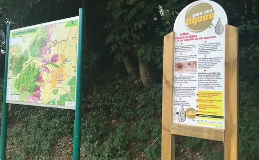 As part of France's national plan against Lyme, 2,000 "Beware of Ticks" signs will be placed at forest entrances. This one stands across from some vineyards in the northeastern town of Kintzheim. Image by David Scales. France, 2017.