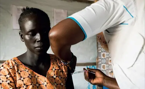 A patient receives her second hepatitis B injection at the Médecins Sans Frontières sexual violence and mental health clinic for refugees who have fled from South Sudan to Uganda.