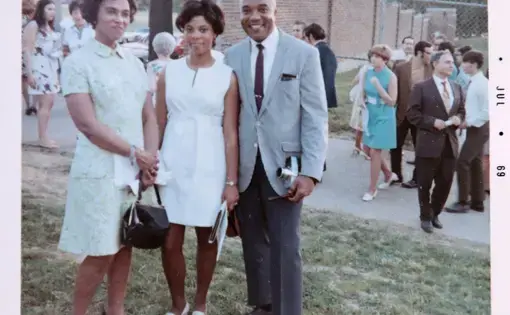 Judy Gladney, center, in a photograph with her parents, Clarice, left, and Dr. John Gladney at her University City High School graduation in 1969. Image courtesy of Judy Gladney. United States, 1969.