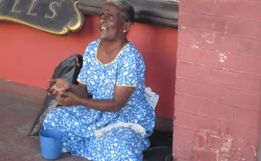 Blind woman sitting outside a shop in Colombo. Image by Ross Velton. Sri Lanka, 2015.