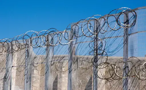 Razor wire fence at the Fremantle Prison in Fremantle, Western Australia. Image by Shutterstock. Australia, 2016.